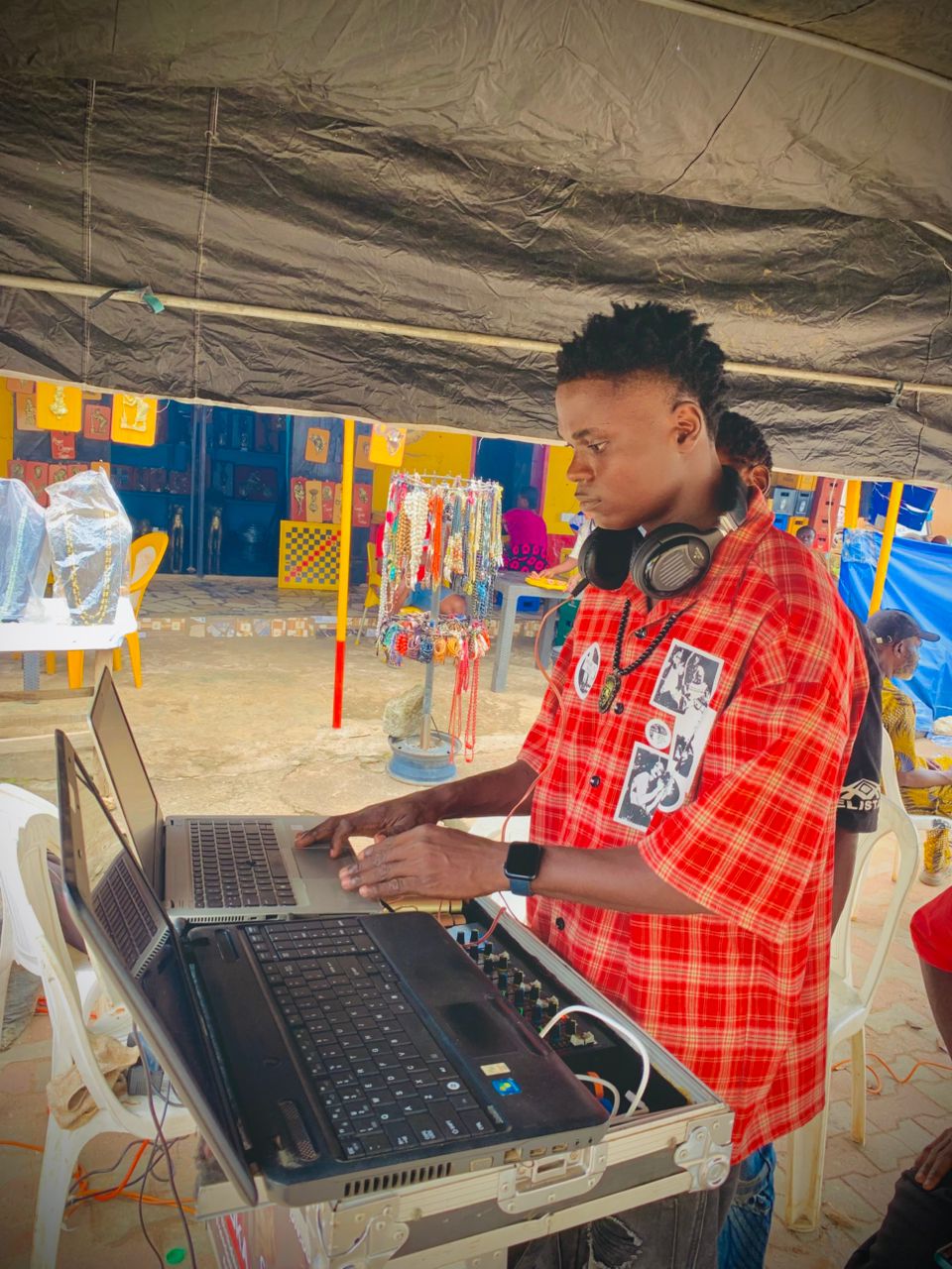 DJ VOKA performing with professional sound equipment at an event in Edo State